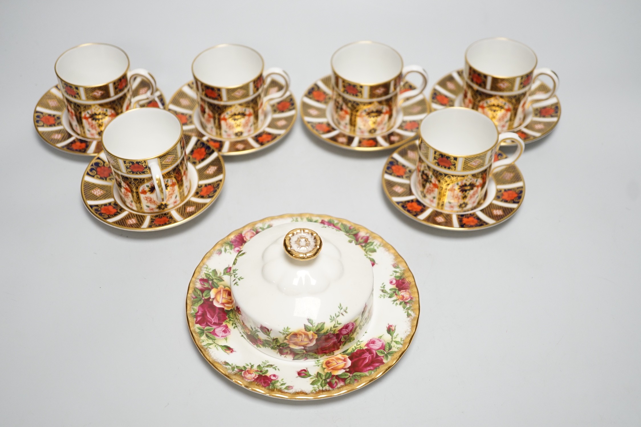 Six Royal Crown Derby coffee cans and saucers and a Royal Albert Country Roses dish and cover